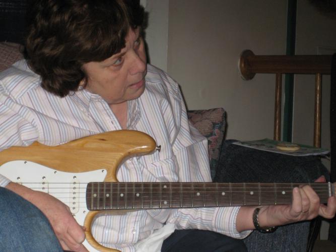Mom learning to play guitar - Git Drew!